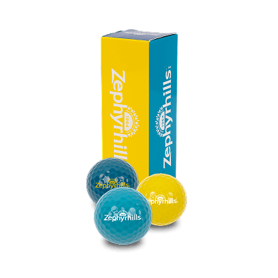 Box of Zephyrhills branded golf balls in yellow and blue, with two visible balls in front.