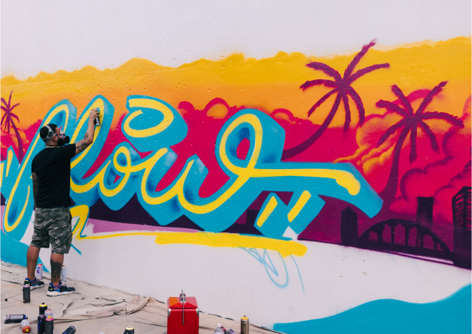 DISEM305 creating aerosol art with the word "flow".